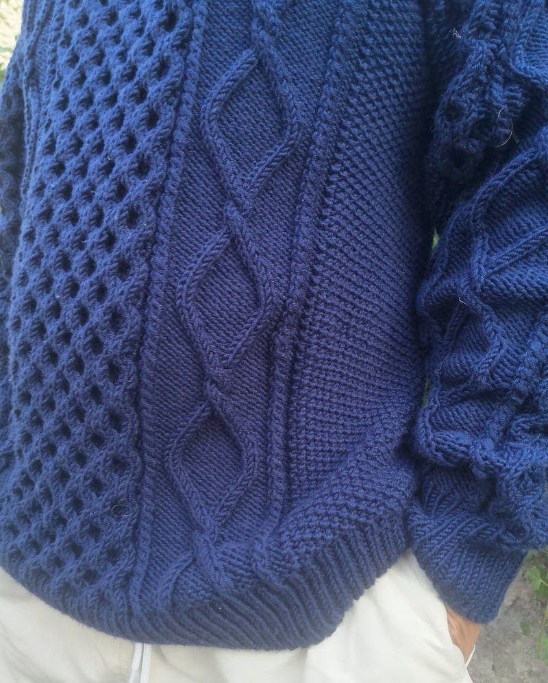 détail du Dagmar Zipper Sweater Man de Petite Knit